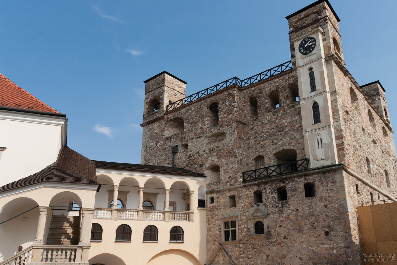 The old tower -- clock, stairs, wall, yard