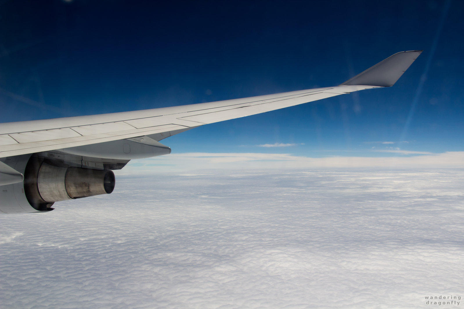 Wing, clouds and blue sky from the airplane -- blue sky, cloud, from airplane, sky, white cloud