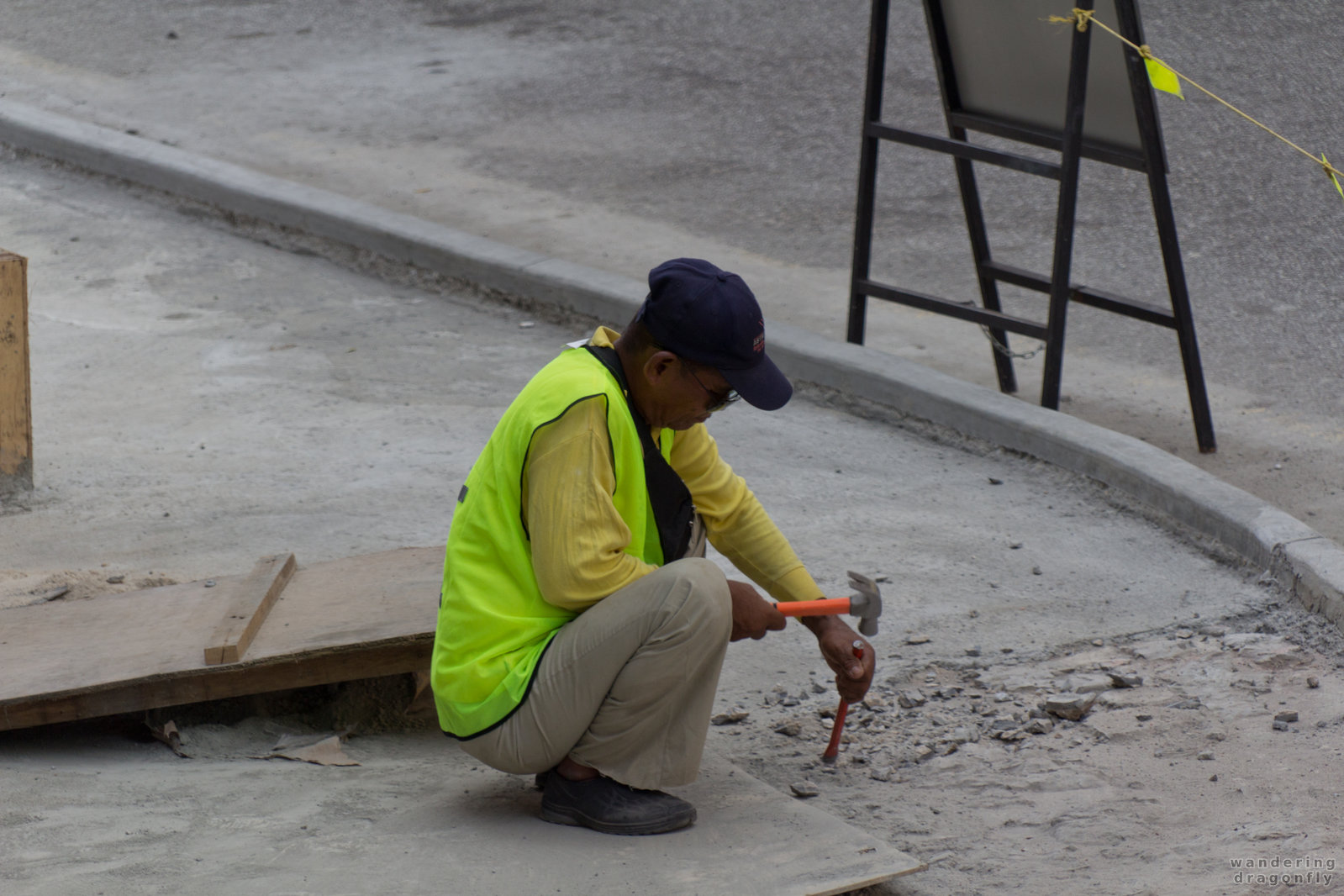 Chisel vs. concrete -- street, worker