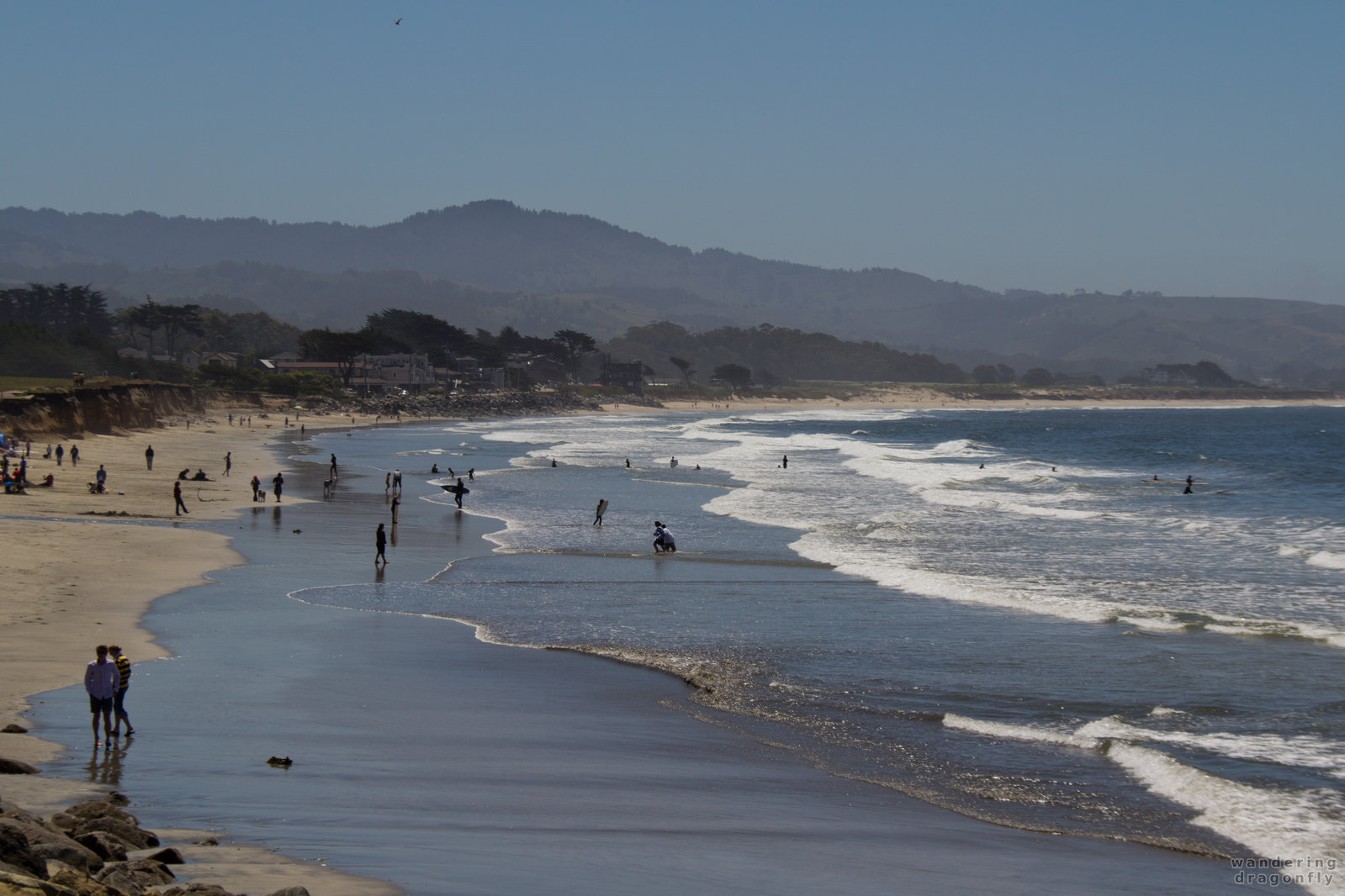 People are enjoying the beach -- beach, ocean, people, surfer