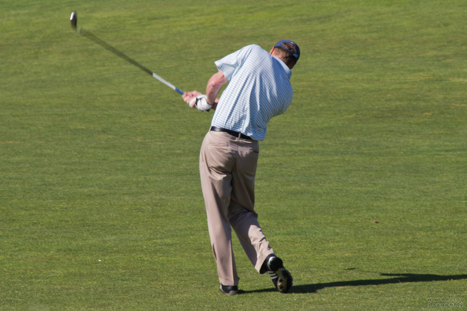 It was a good strike -- golf club, golf course, golf strike, golfer, grass