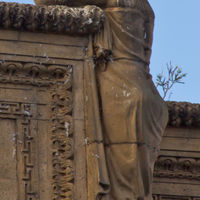 Atop the colonnade there are weeping women in every corner.