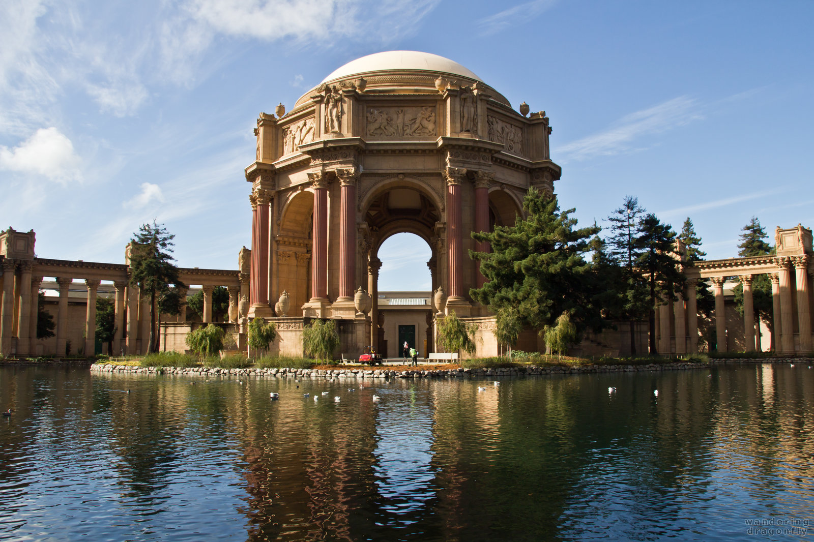 Like a shrine -- building, pillar, pond, reflection, sculpture, tree