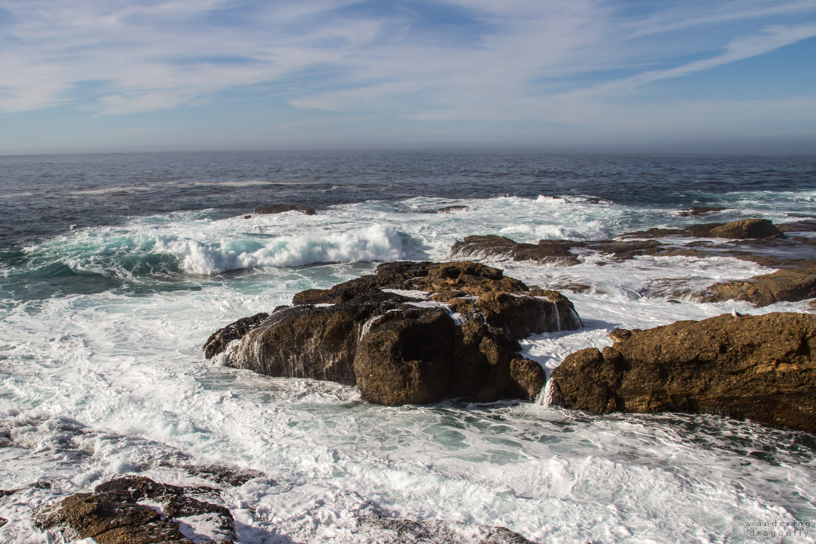 Soaked cliffs -- crashing wave, ocean, rock, sky, water, wet cliff
