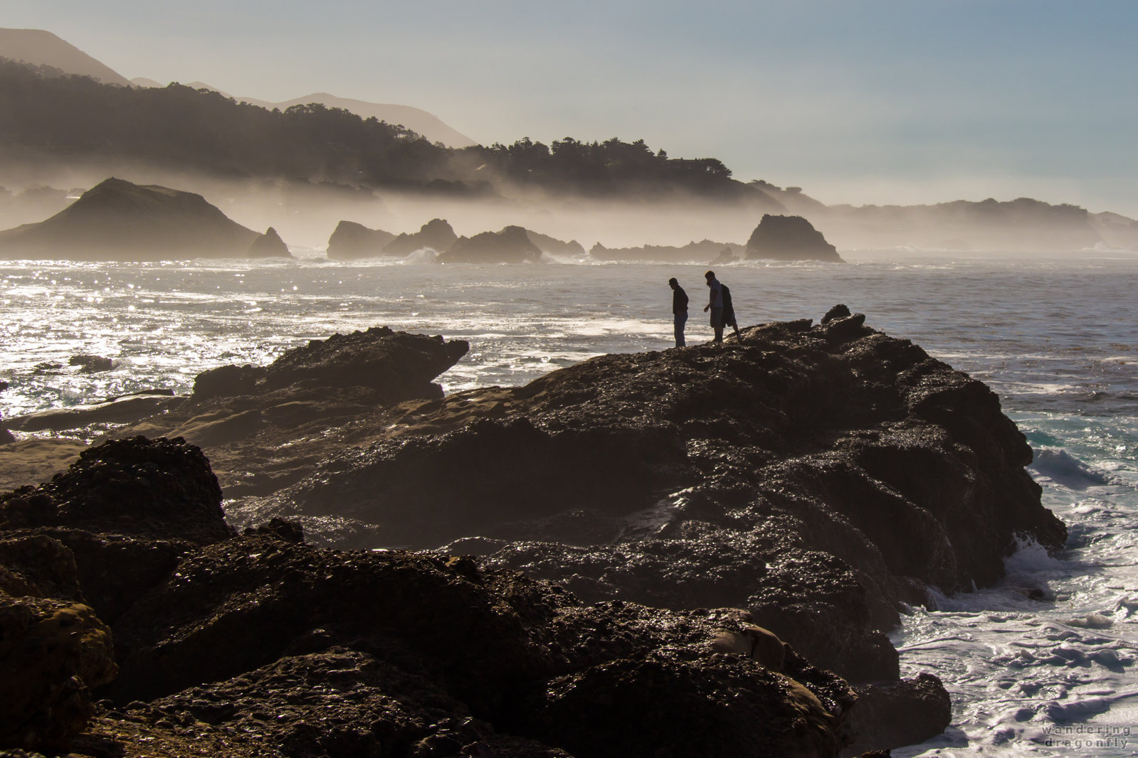 Walking on the wet cliffs -- cliff, cove, fog, hiker, ocean, rock, water