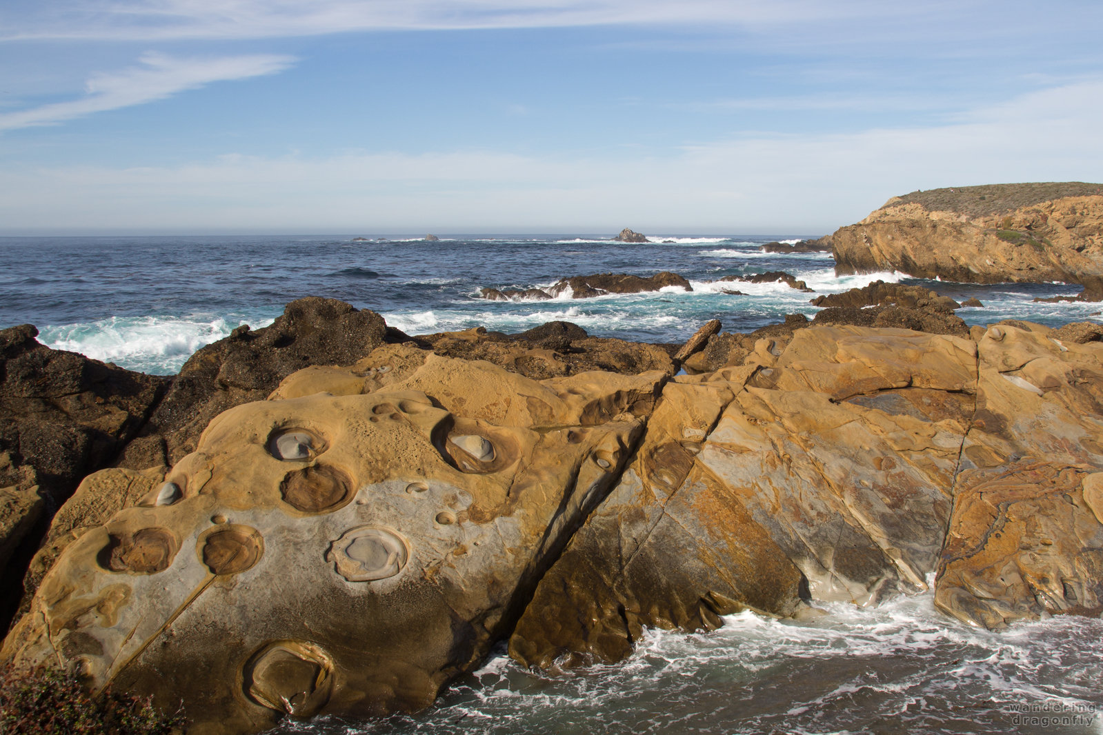 Strange erosion patterns -- cliff, erosion pattern, ocean, sky, water