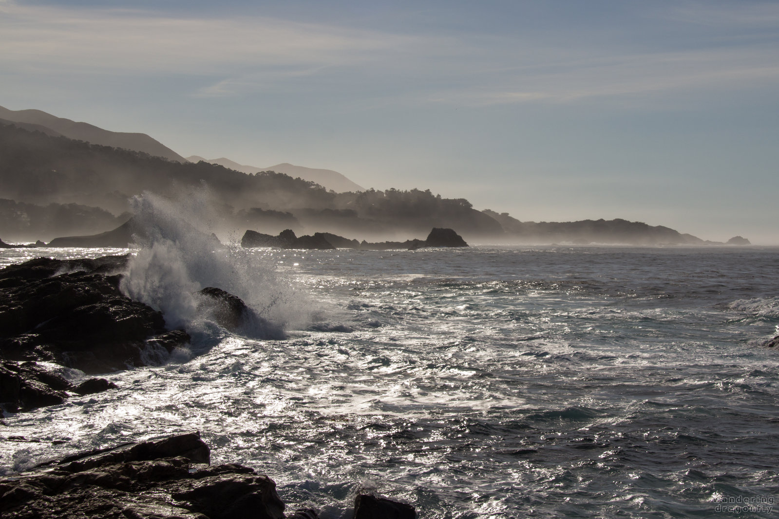 Sparkling -- cliff, crashing wave, fog, ocean, sky, water drops