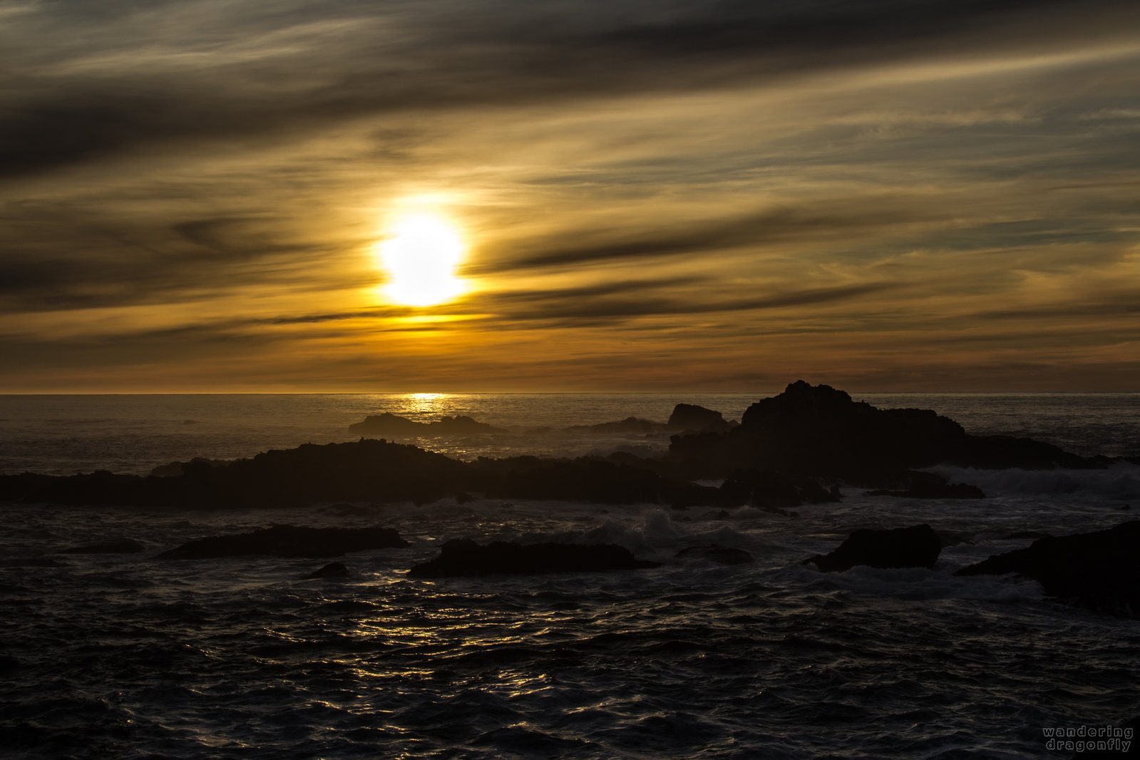 Darkness is coming -- cloud, ocean, rock, sun, sunset, water, wave