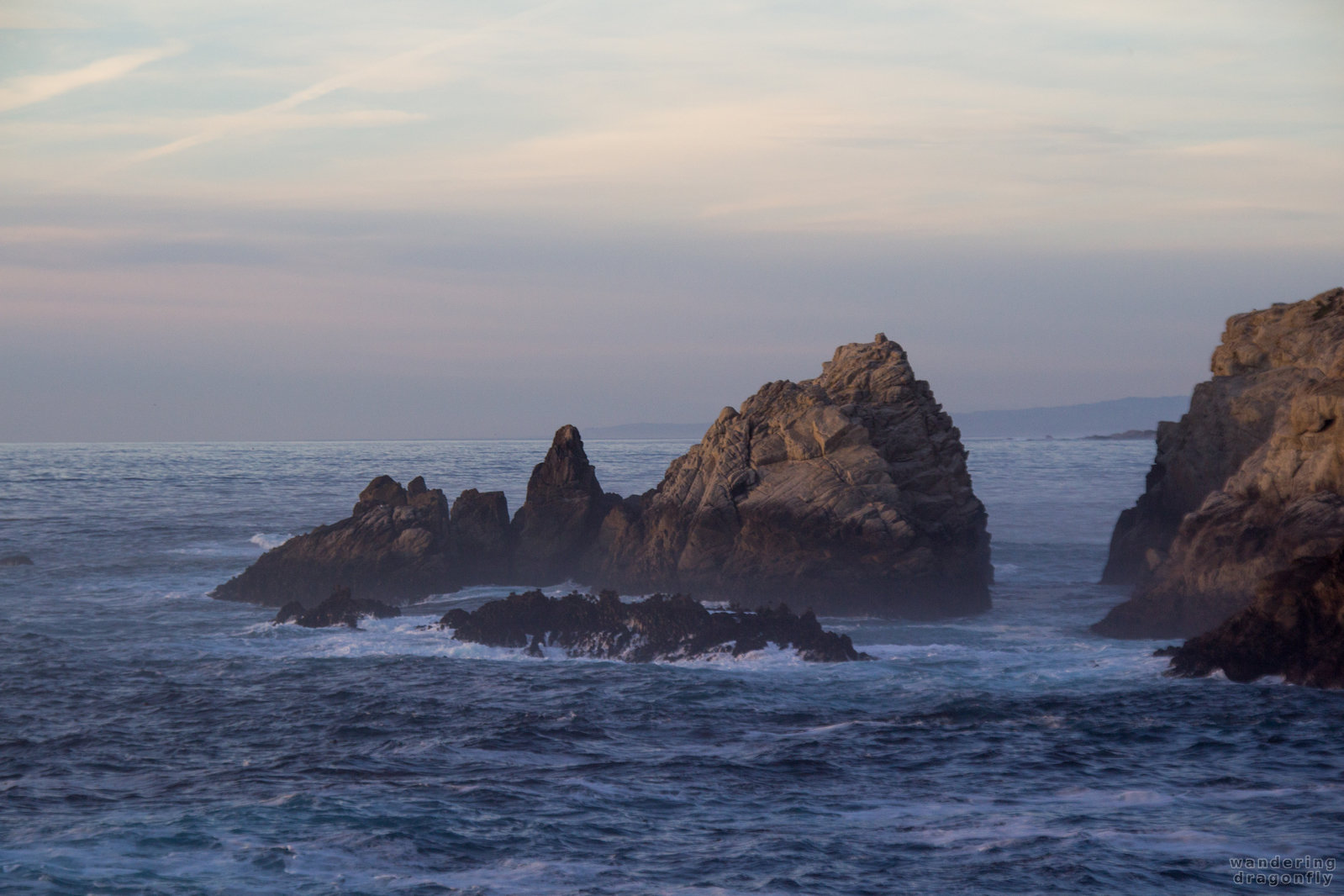 Gloomy ocean -- cliff, ocean, rock, sky, twilight, water