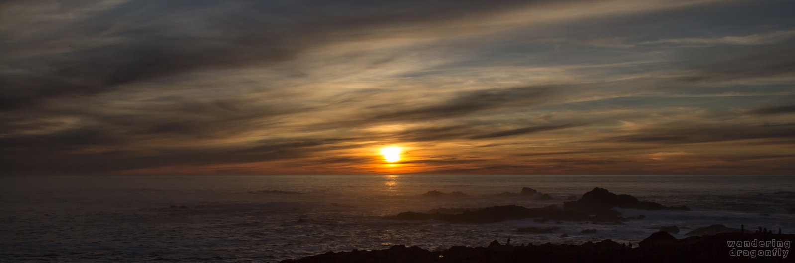 Transition from darkness to brightness -- cloud, ocean, rock, sun, sunset, water, wave