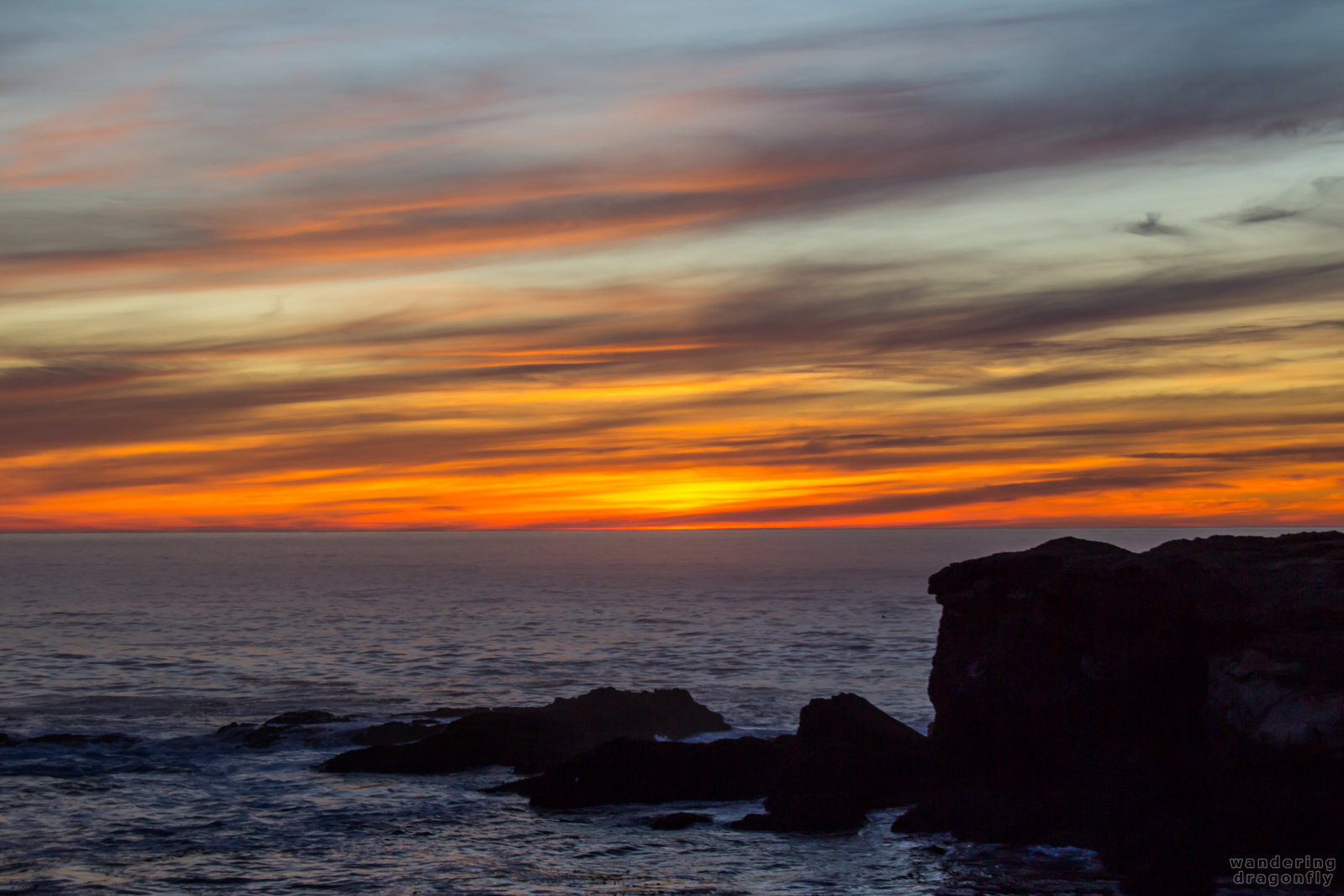Amazing colors even after sunset -- cloud, ocean, rock, sun, sunset, water, wave