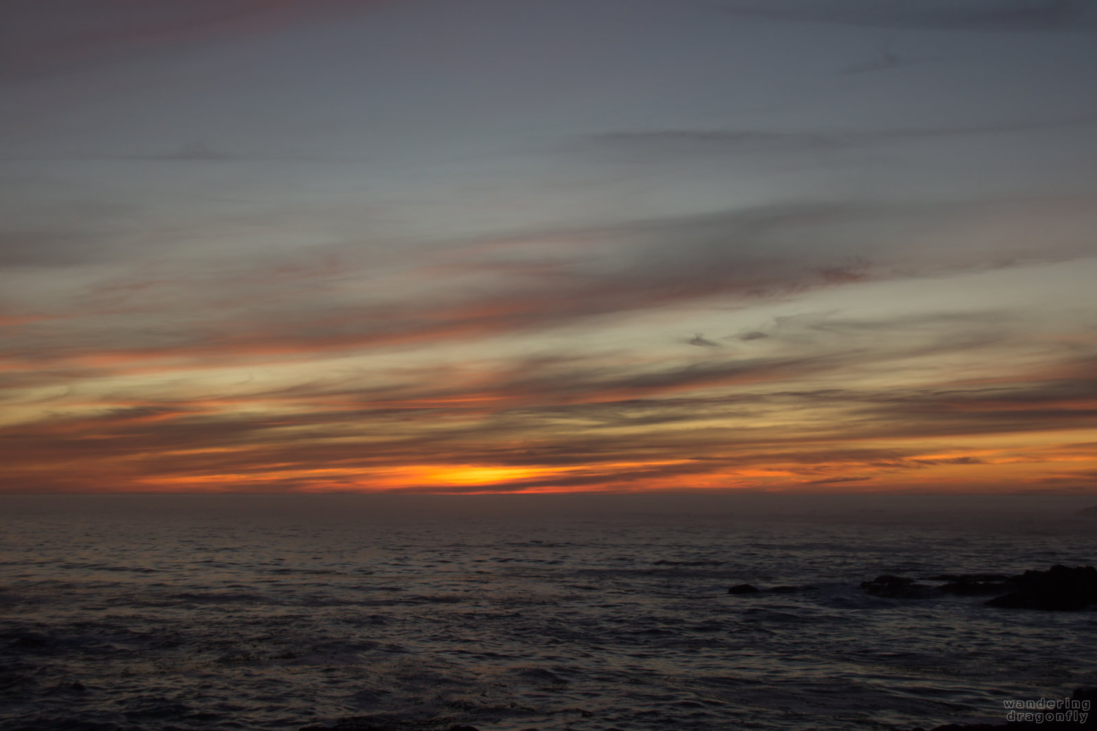 Minutes before total darkness -- cloud, ocean, rock, sunset, water, wave