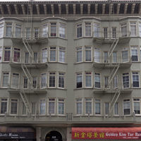 The exit from the interior of the building is through the windows. The ladder from the lowest level of the fire escape to the ground is folded up to prevent persons (such as burglars) from accessing the fire escape from the ground.