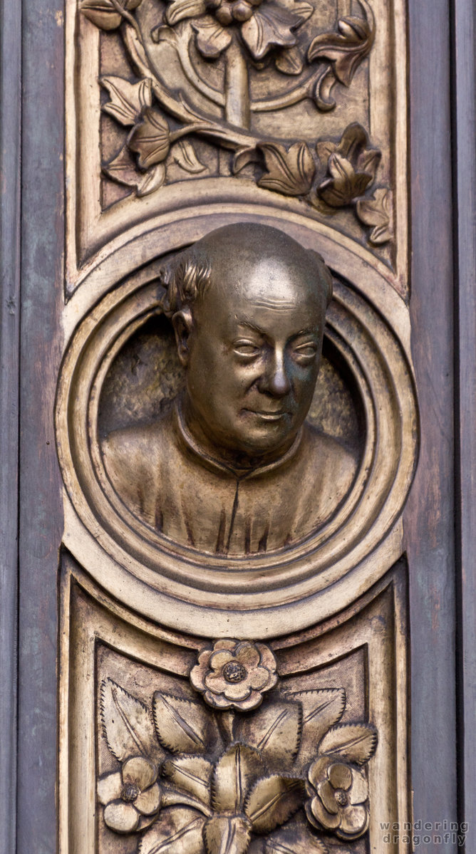Bust relief on the cathedral's gate -- art, relief