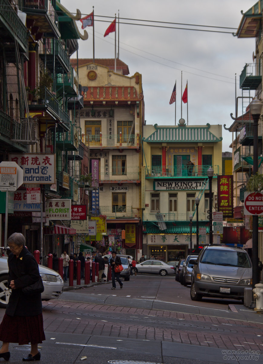 The colorfully painted Waverly Place in Chinatown -- house, street, woman