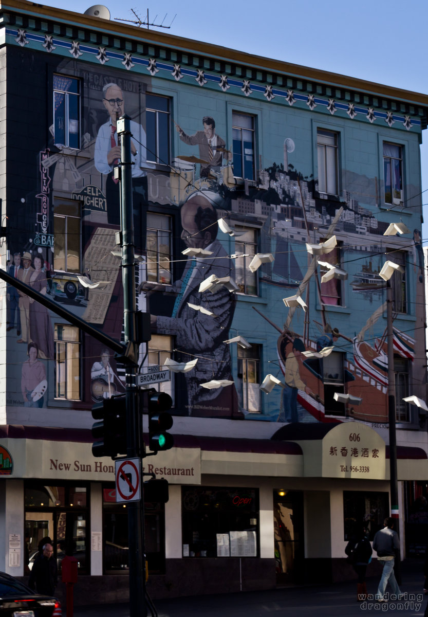 Mural (wall painting) with 'flying' books -- mural, street