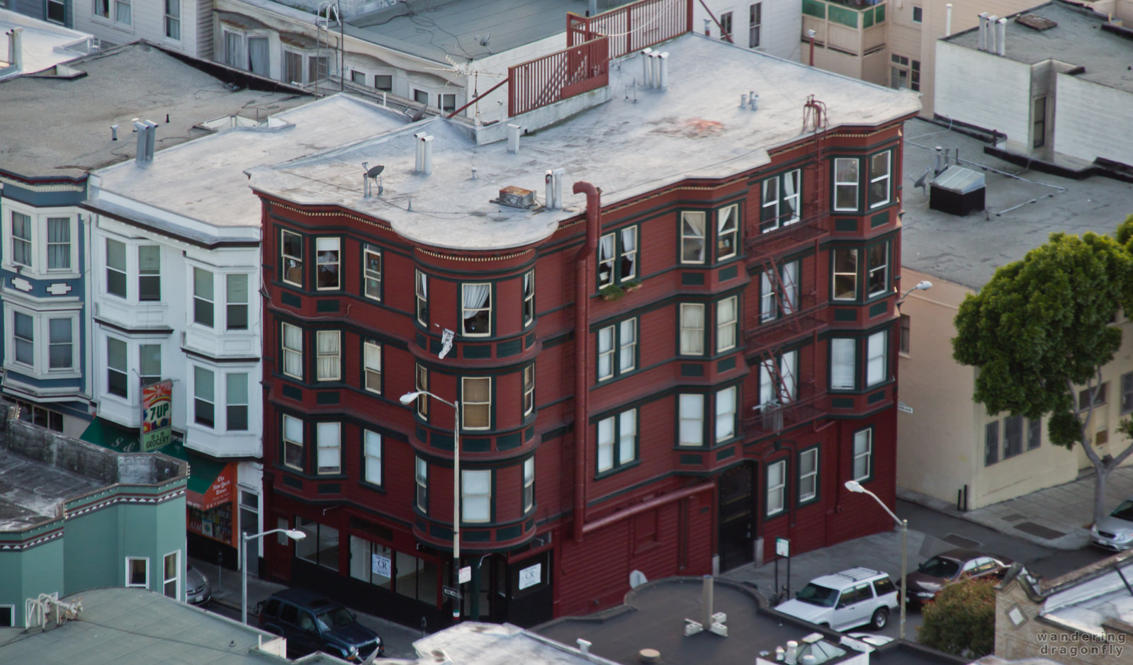 Pretty house in an unusual dark red color -- building, red, street