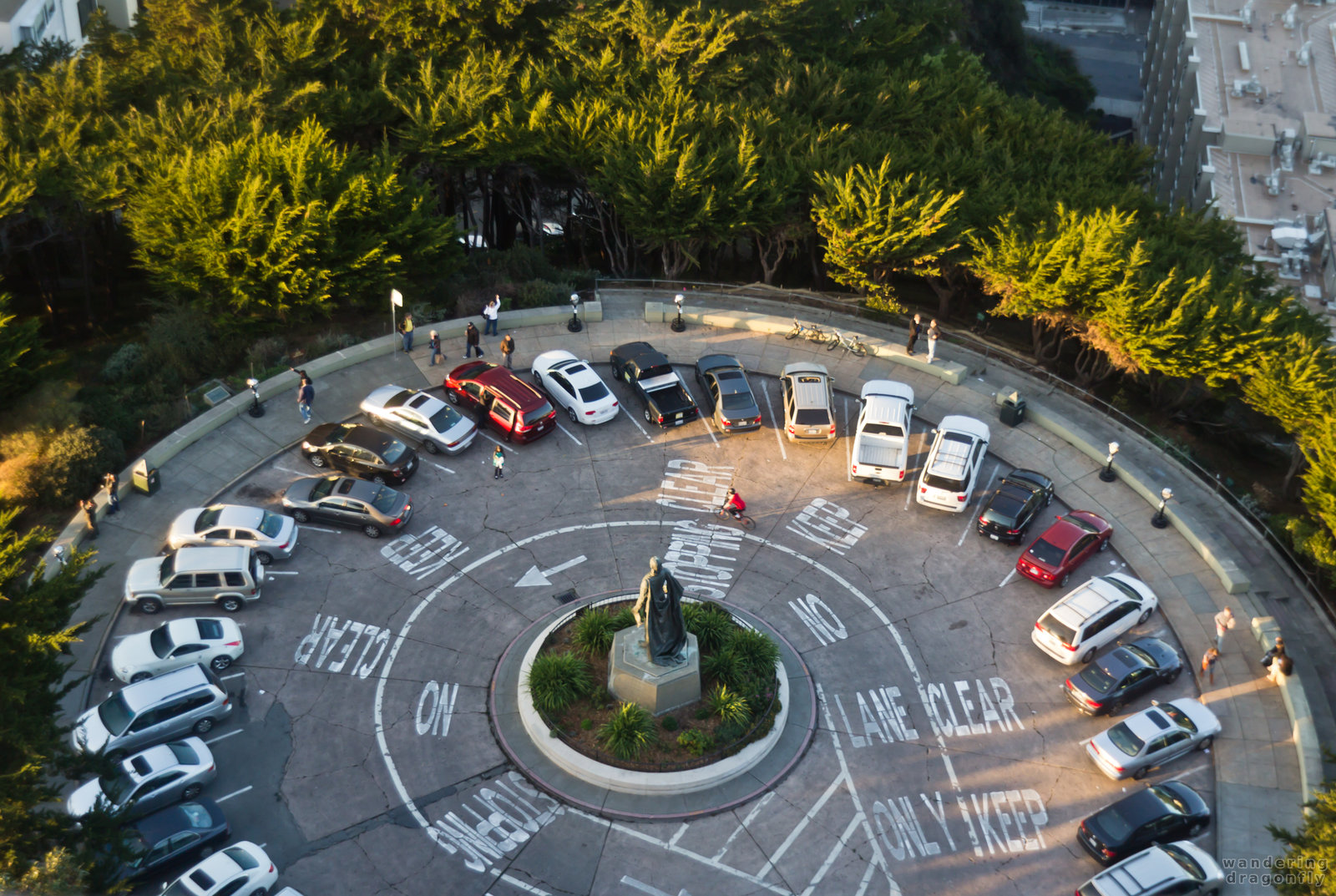 Parking area at the bottom of the Coit Tower -- car, road, street sign